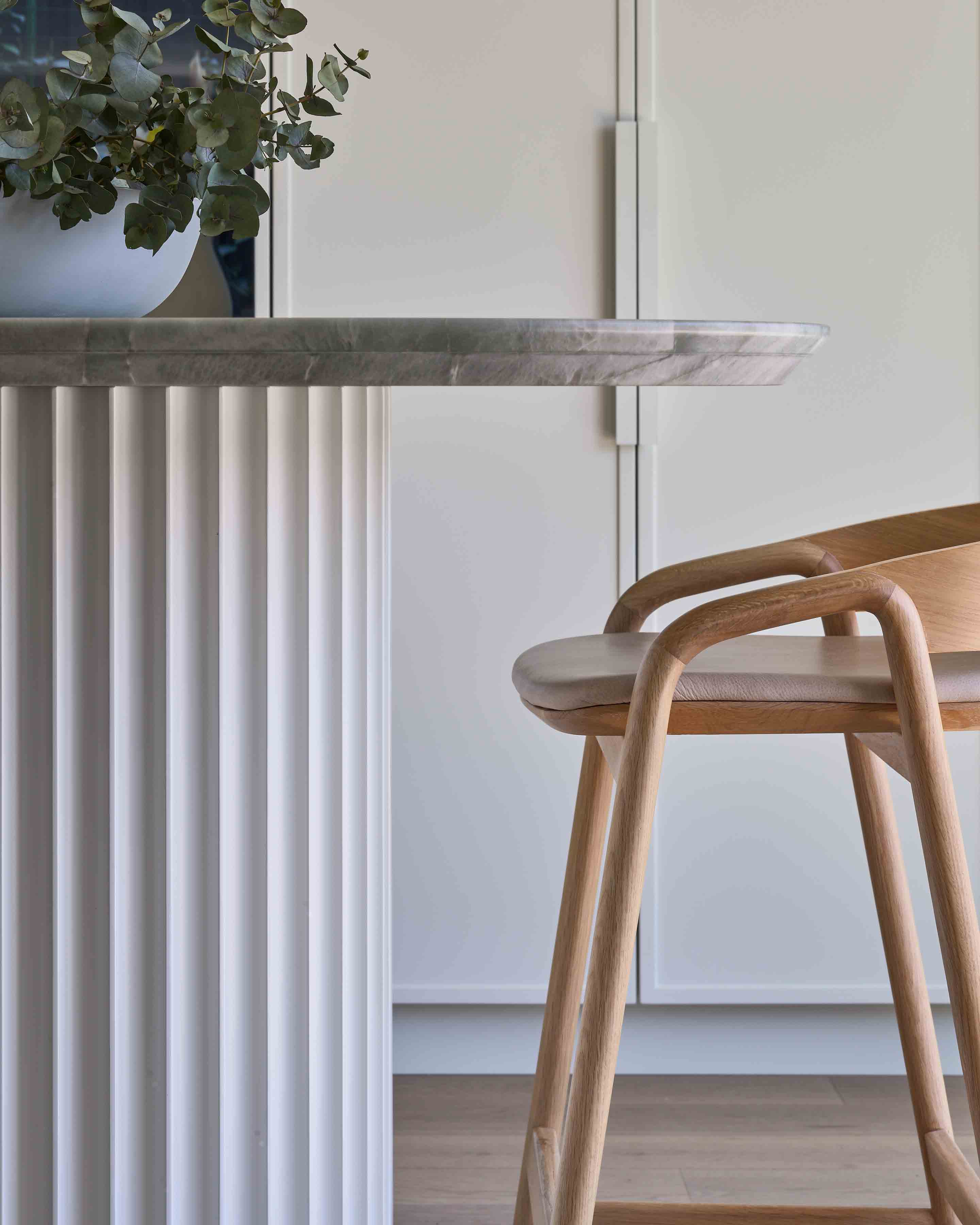 Fluted island detail in oak and marble